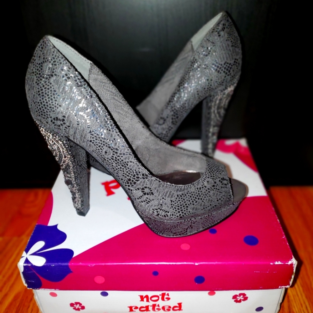 Uniquely detailed grey platform open toes